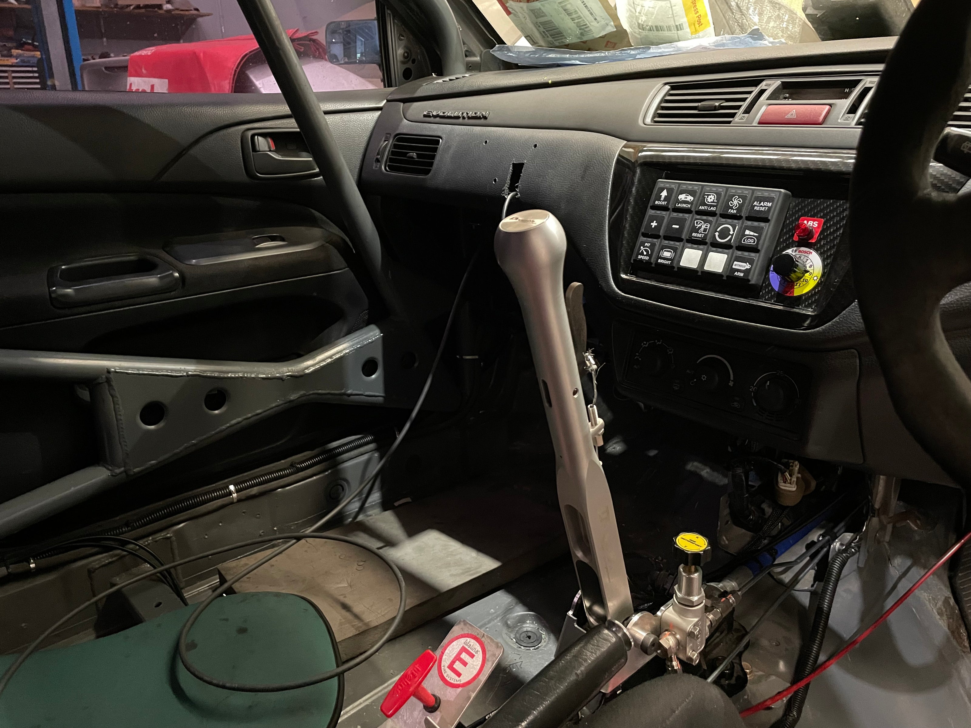 EVO cabin with Bosch ABS map switch and ABS lamp on the dash panel, hydraulic handbrake and bias plumbing