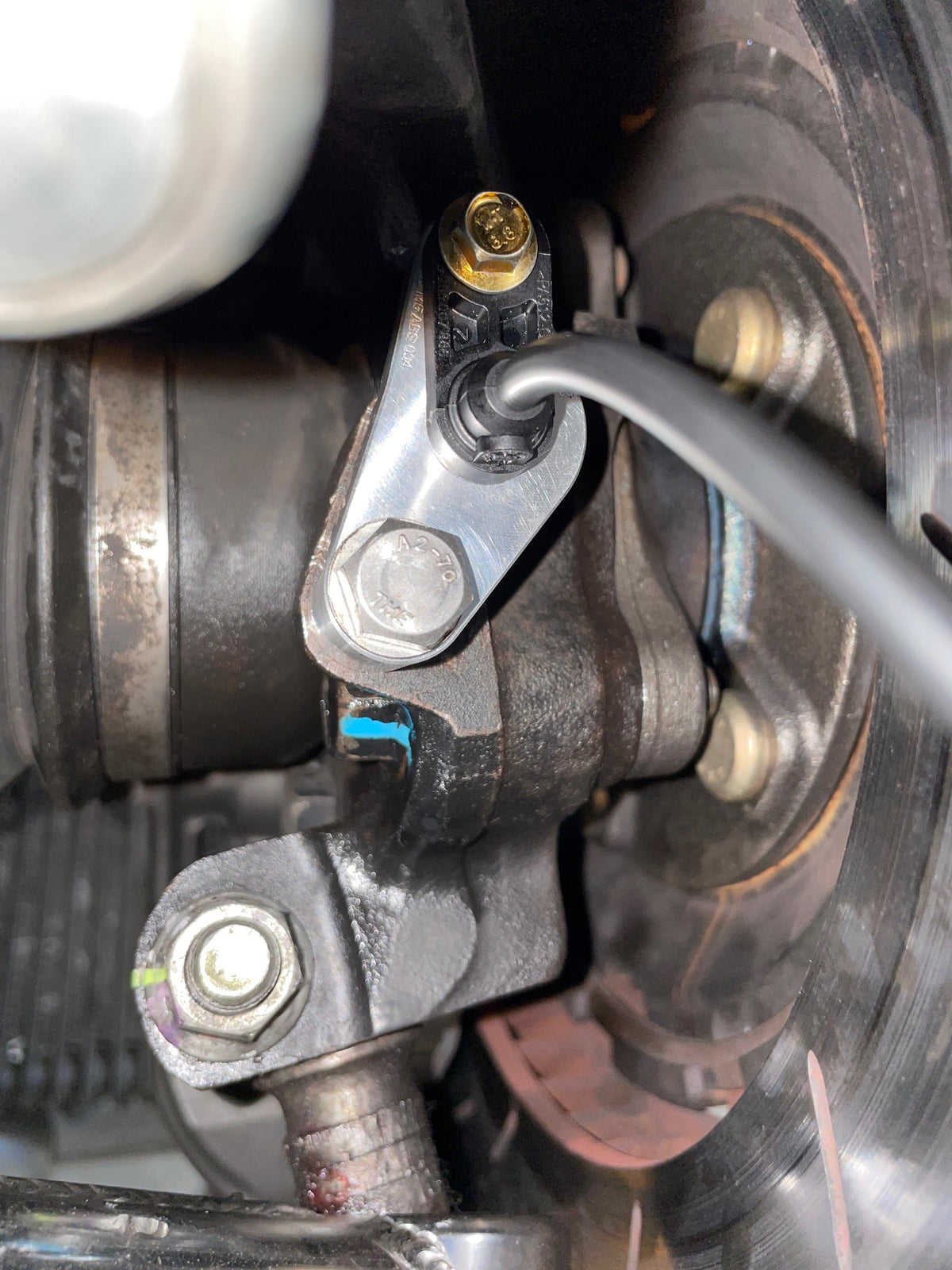 909 Motorsport billet wheel speed sensor mount and Bosch DF11 sensor at the EVO 7-9 hub