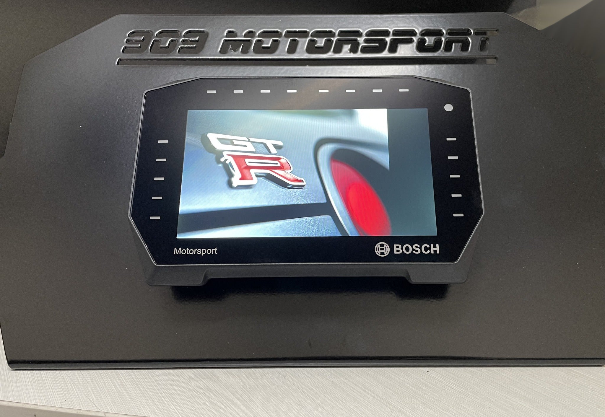 Bosch DDU 11 digital dash display on the 909 Motorsport display stand