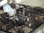 Under-bonnet master cylinder and brake bias valve area on a Mitsubishi Lancer EVO X fitted with the 909 Bosch Motorsport M5 ABS kit