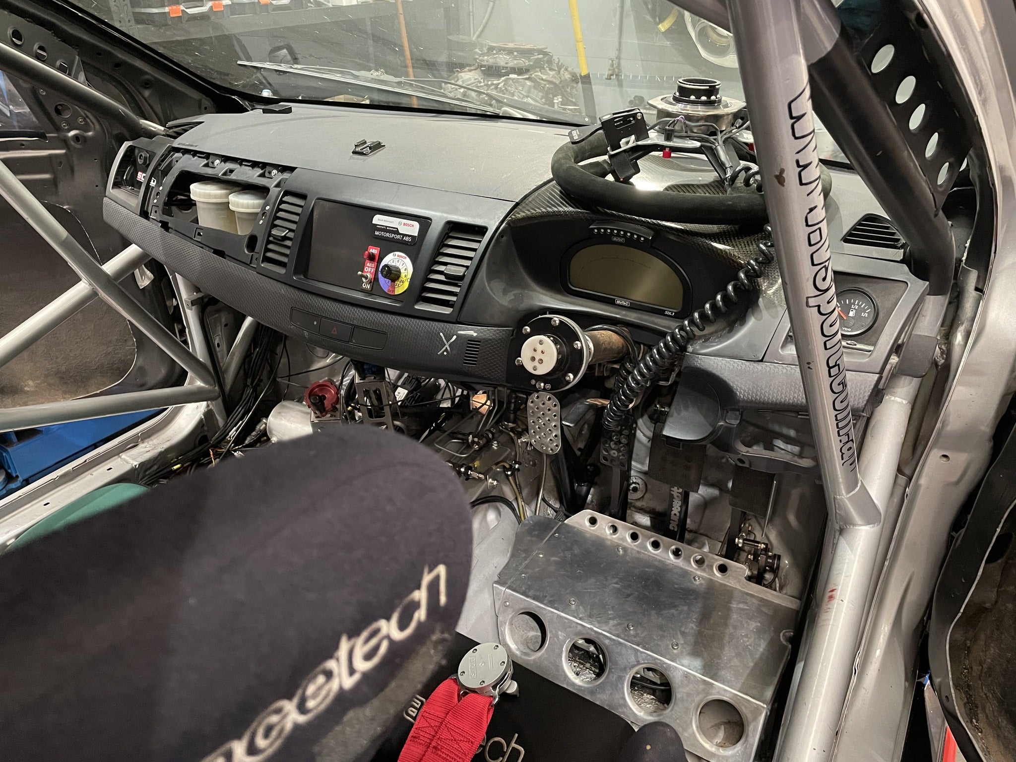 Race-prepared Mitsubishi EVO X cabin during the Bosch Motorsport M5 ABS installation