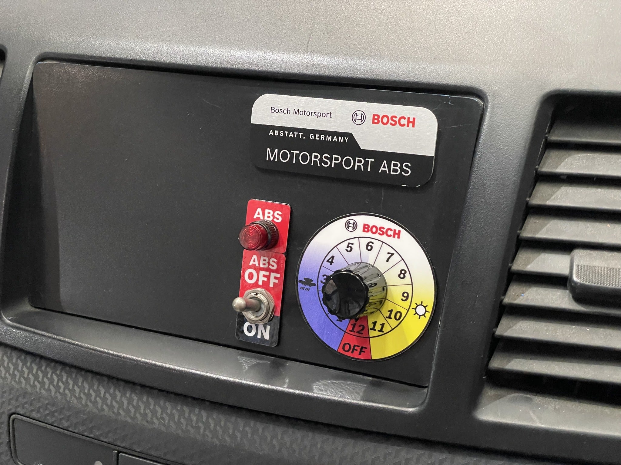 Bosch Motorsport ABS 12-position map switch and ABS-off toggle integrated in the Mitsubishi EVO X dash