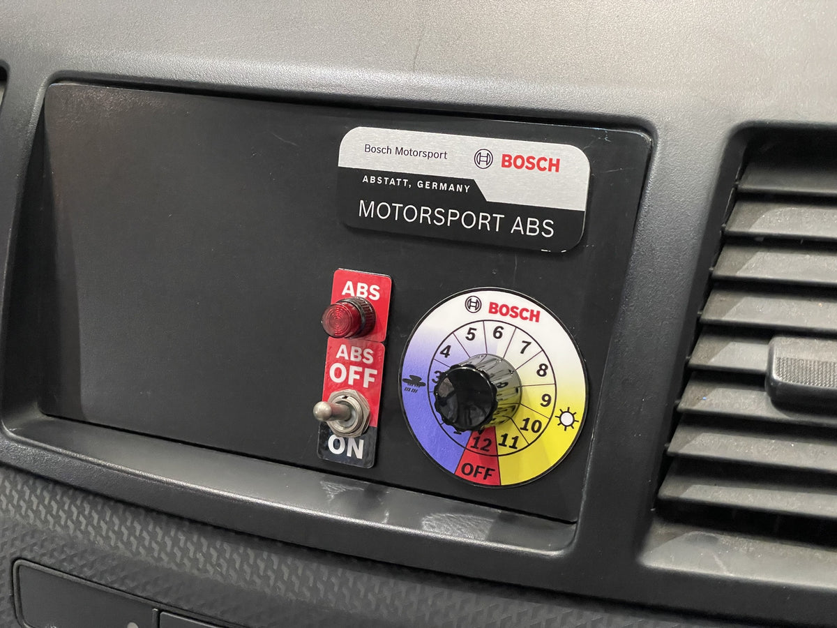 Bosch Motorsport ABS 12-position map switch and ABS-off toggle integrated in the Mitsubishi EVO X dash