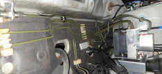 Brake hard lines routed to the Bosch Motorsport M5 ABS hydraulic unit on a Mitsubishi Lancer EVO 7-9