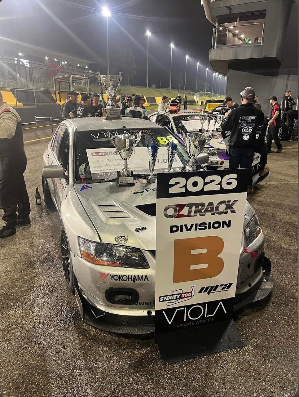 Powertek Racing EVO with trophies after the 2026 Sydney 300 — class win and outright win, running Bosch Motorsport M5 ABS