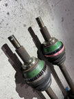 Pair of Nissan Skyline GT-R rear driveshafts with 909 outboard tone rings fitted to the CV joints, ready for installation