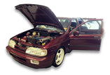 909 Motorsport Ford Sierra Cosworth development car with bonnet up and doors open, showing the engine bay